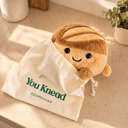 Crumb sourdough plush toy with its reusable bread bag